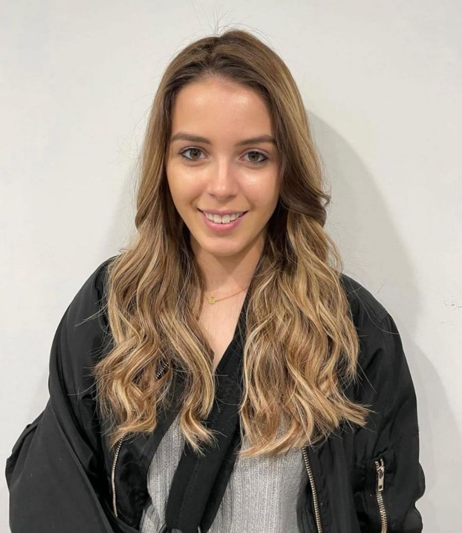 Brunette with blonde balayage, long waves